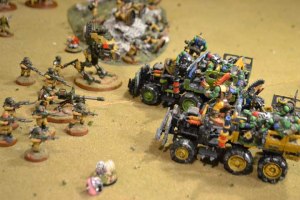 The Trukks charge the Imperial line. The Green Trukk rams the Sentinel; the Yellow Trukk comes up short.